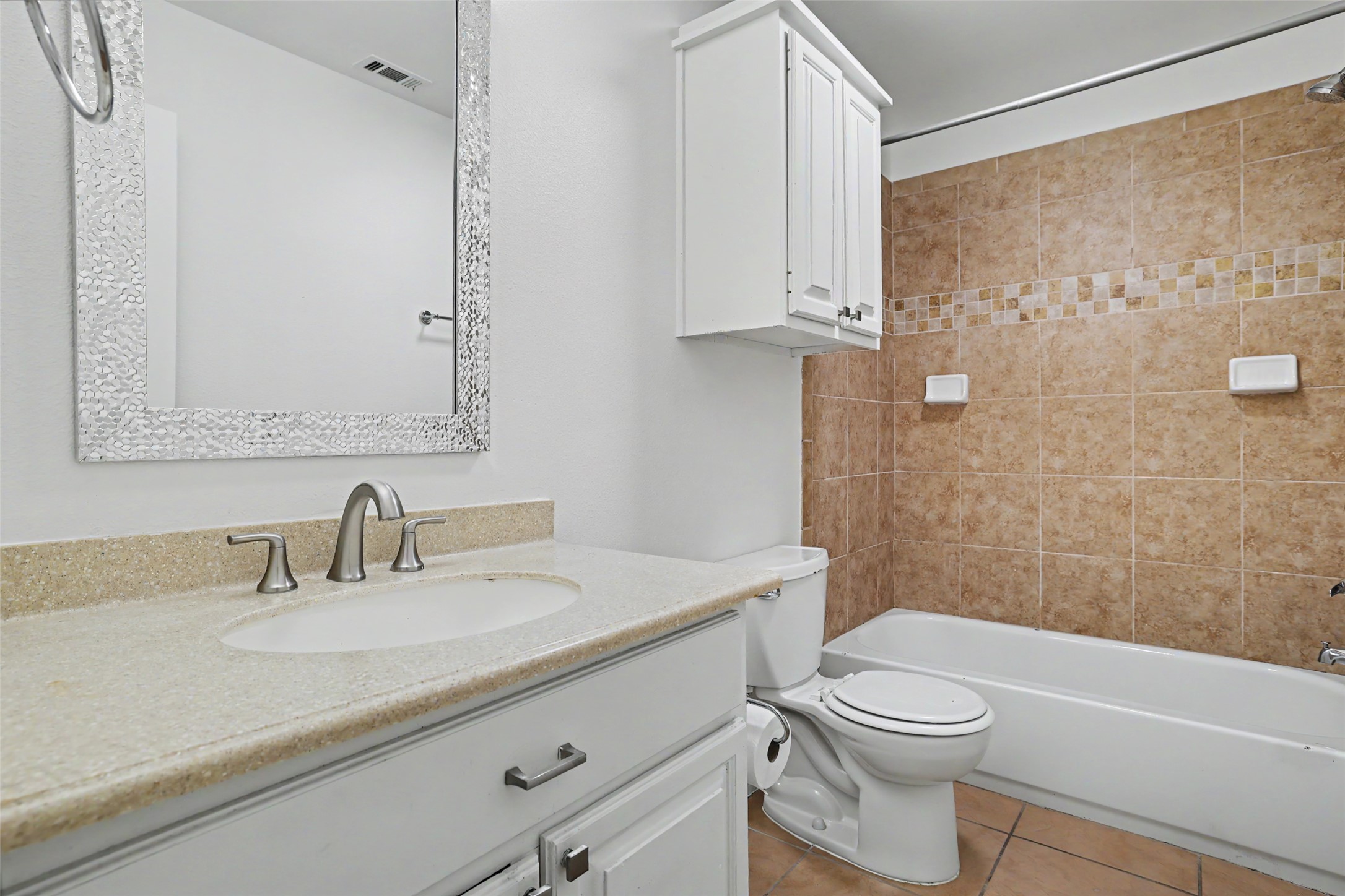 6307 Chesterfield Avenue Austin, TX 78752 - Photo 11 of 20 a bathroom with a sink a toilet and shower
