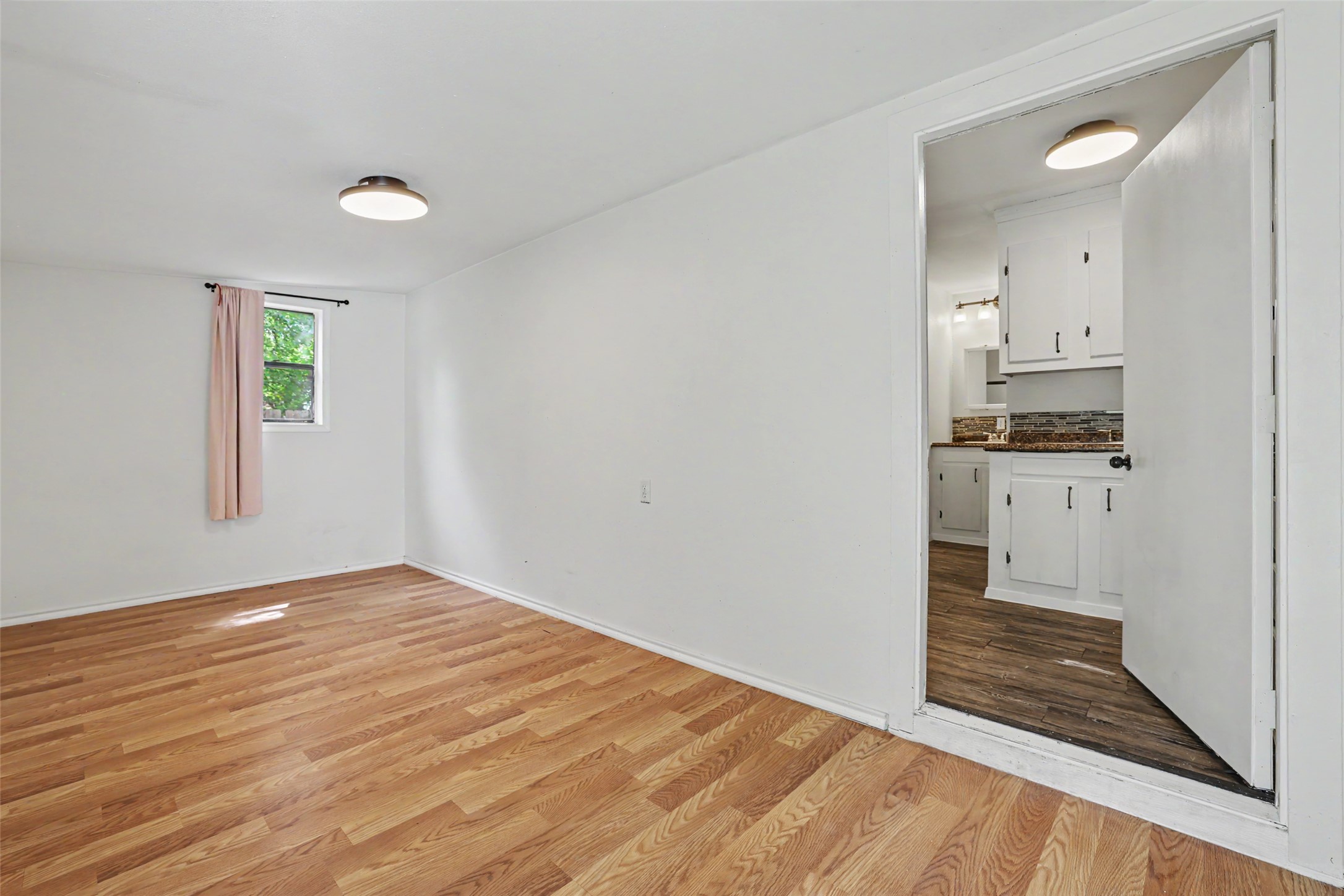 6307 Chesterfield Avenue Austin, TX 78752 - Photo 14 of 20 a view of a kitchen cabinets and wooden floor
