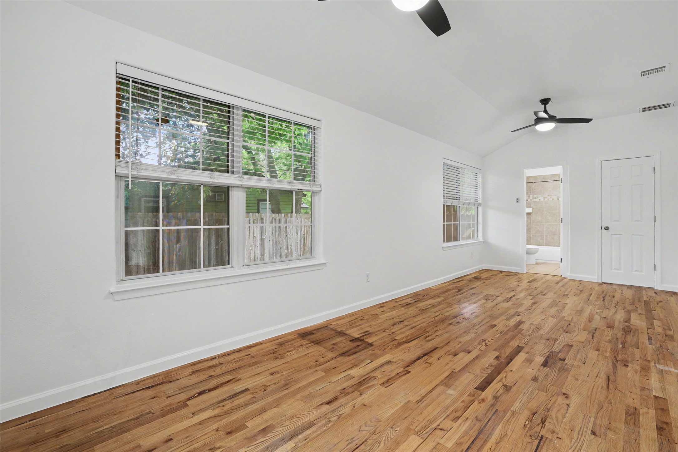 6307 Chesterfield Avenue Austin, TX 78752 - Photo 5 of 20 a view of empty room with wooden floor and fan