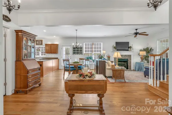 a living room with fireplace furniture and a flat screen tv