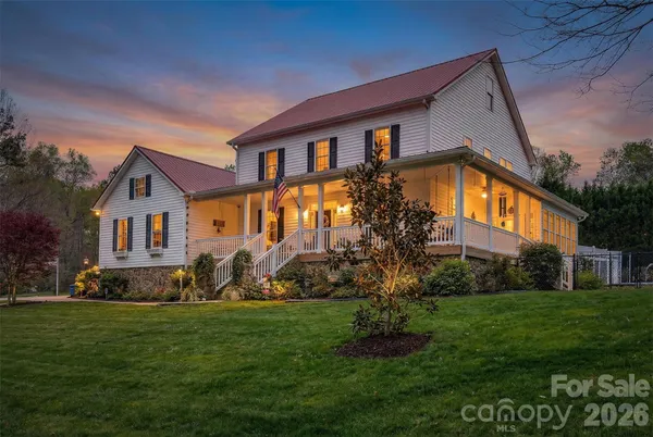 a front view of a house with a garden and plants