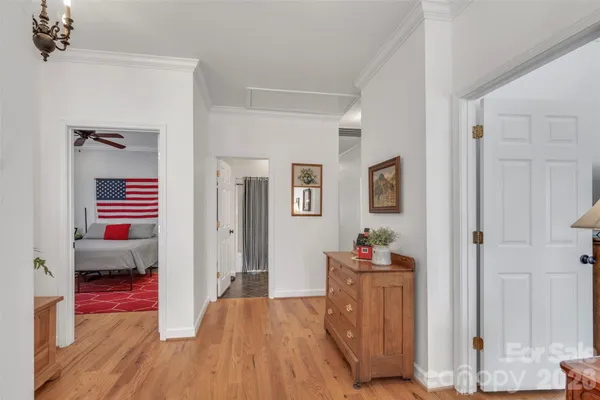 a bed room with a bed and a chandelier