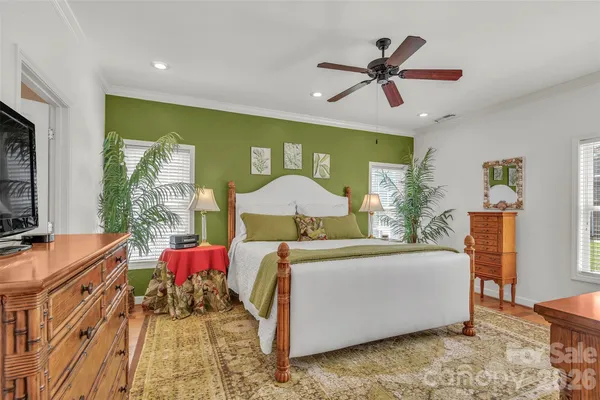 a bathroom with a tub a toilet and a shower