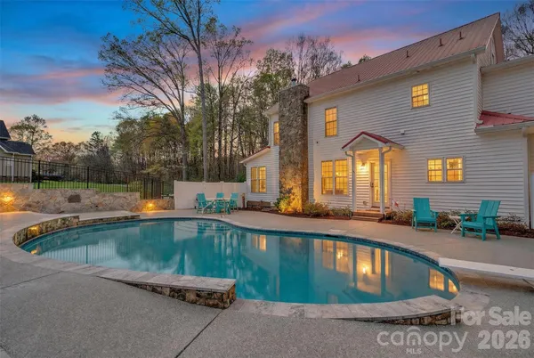 a view of a swimming pool with a patio