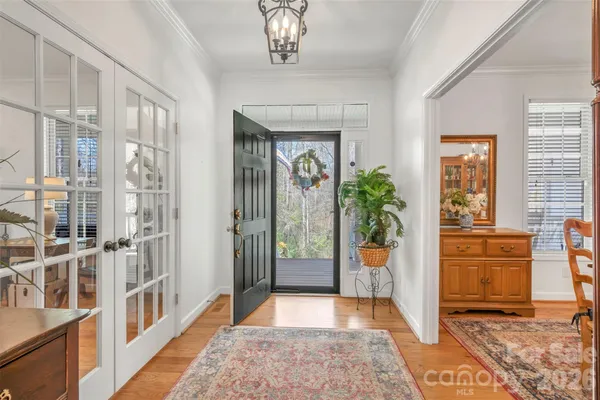 a hallway with windows and flower pot