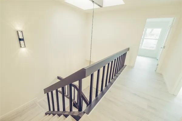 a view of a hallway with stairs