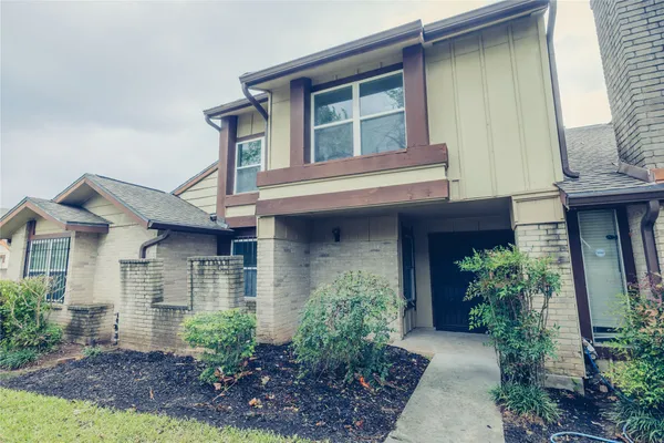 a front view of a house with an outdoor space