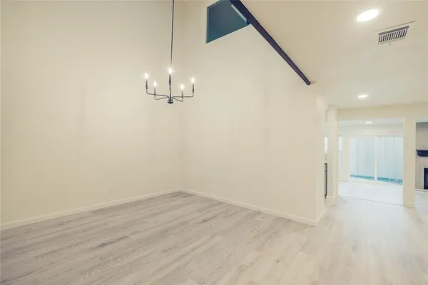 a view of a room with wooden floor and staircase