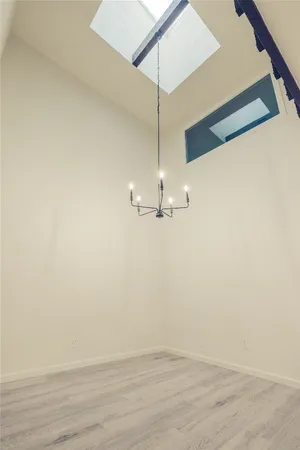 a view of a room with wooden floor