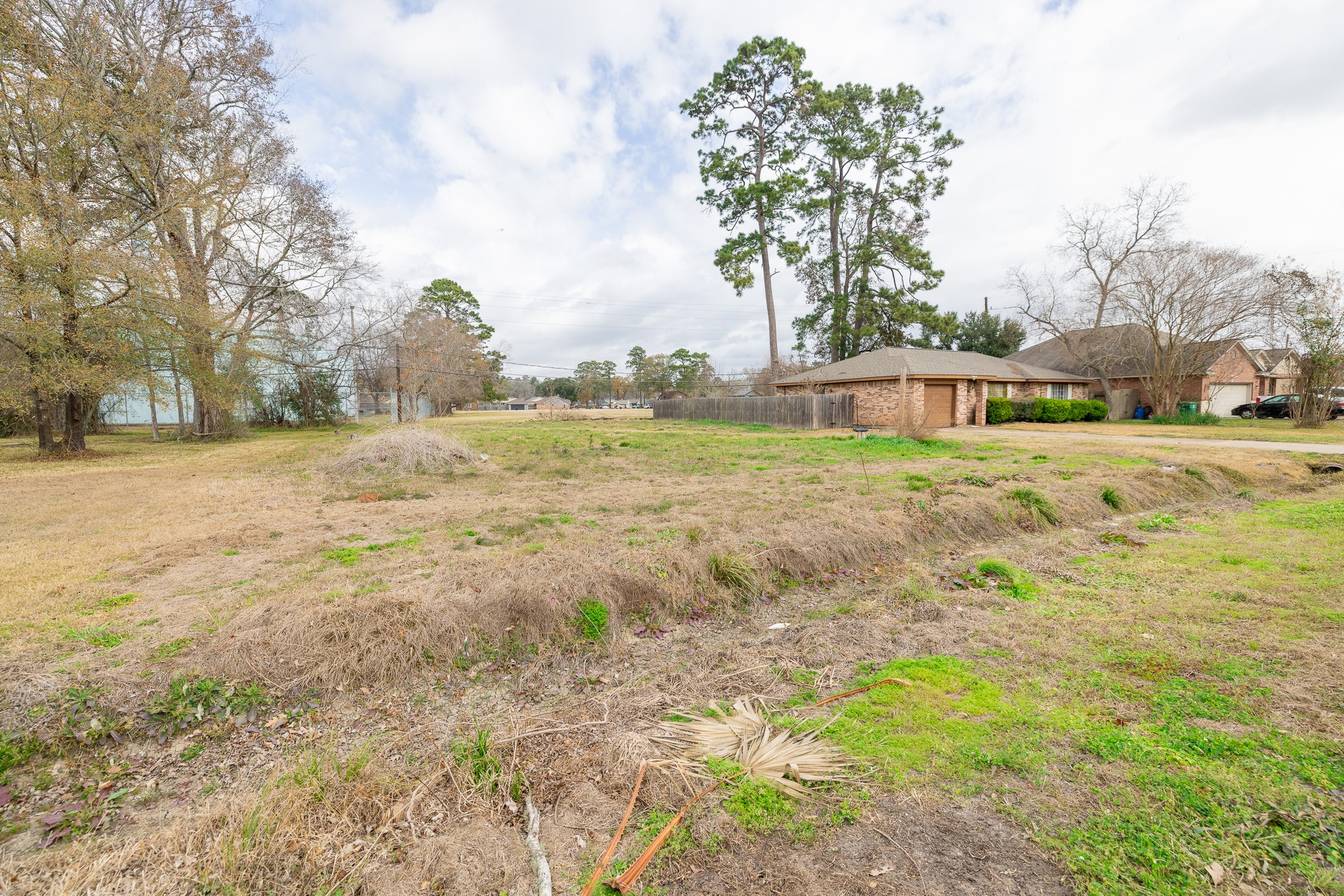 329 Swift Current Drive Huffman, TX 77336 - Photo 2 of 12 a view of big yard with a house