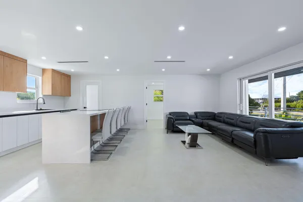 a kitchen with stainless steel appliances a refrigerator and a sink