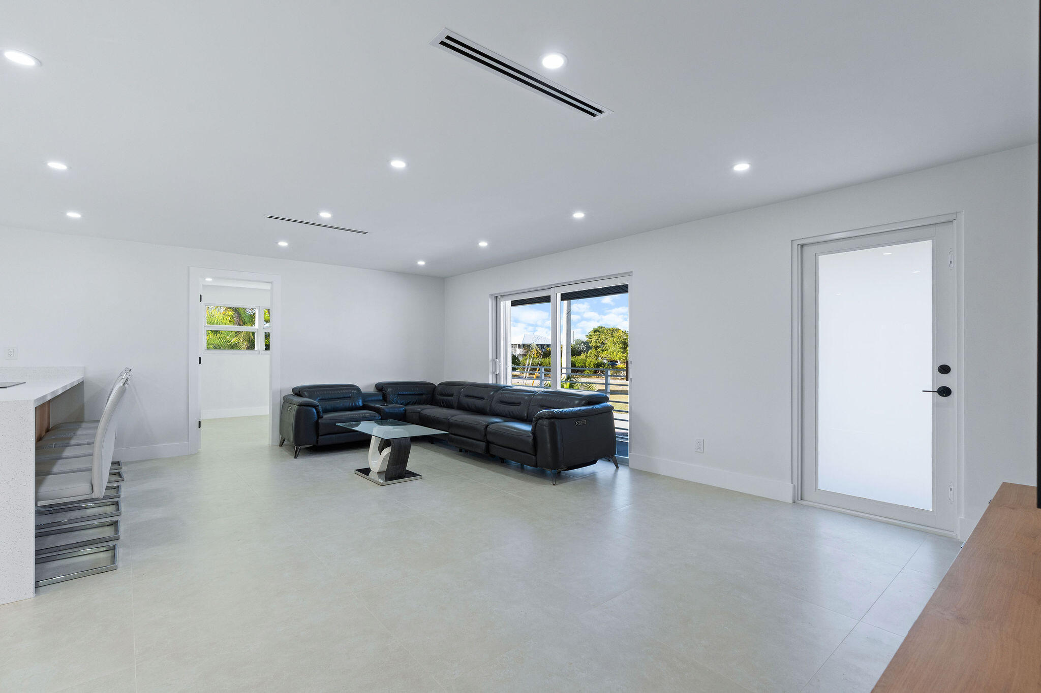 30368 Killdeer Lane Big Pine Key, FL 33043 - Photo 17 of 59 a living room with furniture and a wooden floor