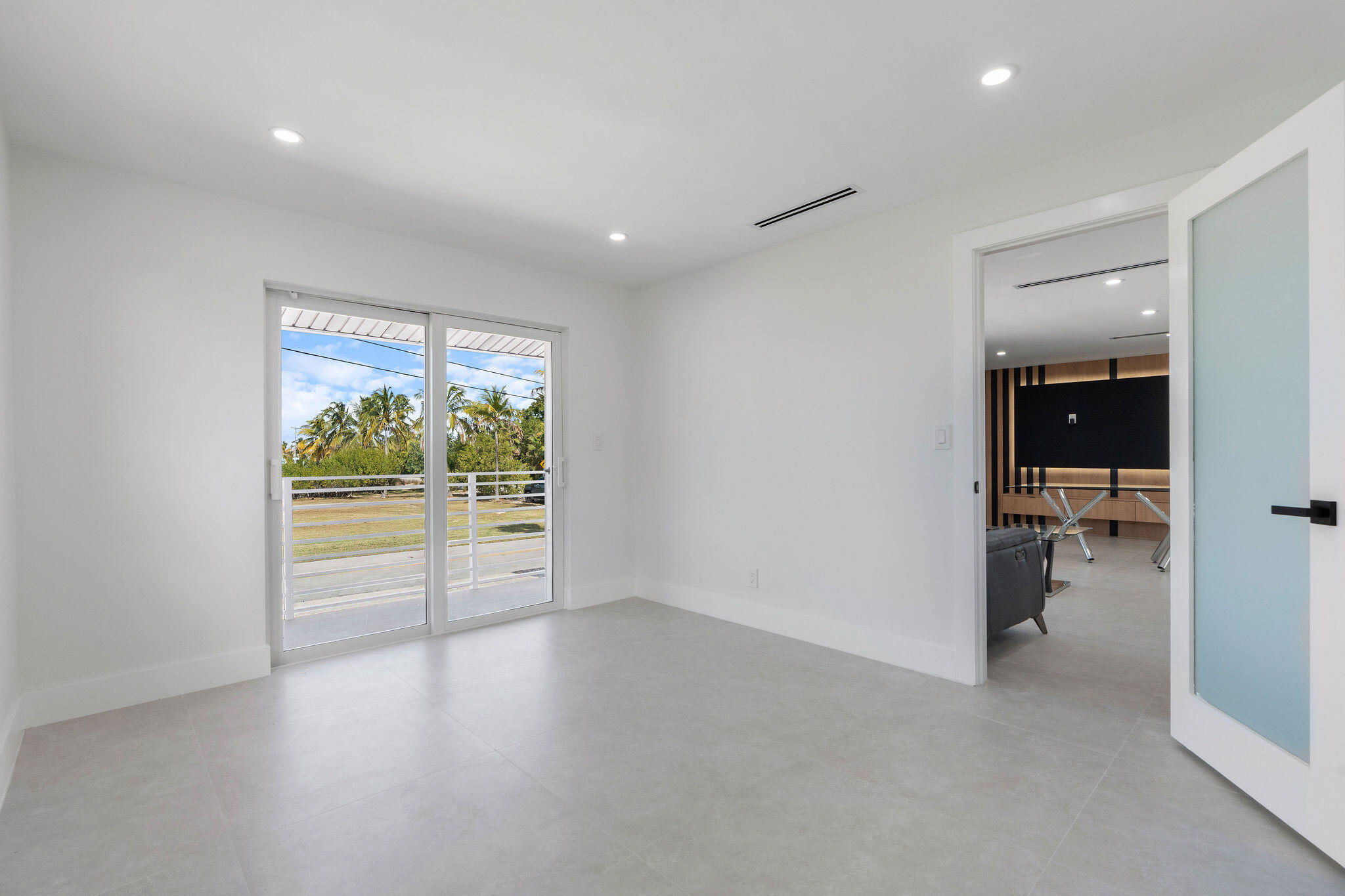30368 Killdeer Lane Big Pine Key, FL 33043 - Photo 25 of 59 wooden floor in an empty room with a window