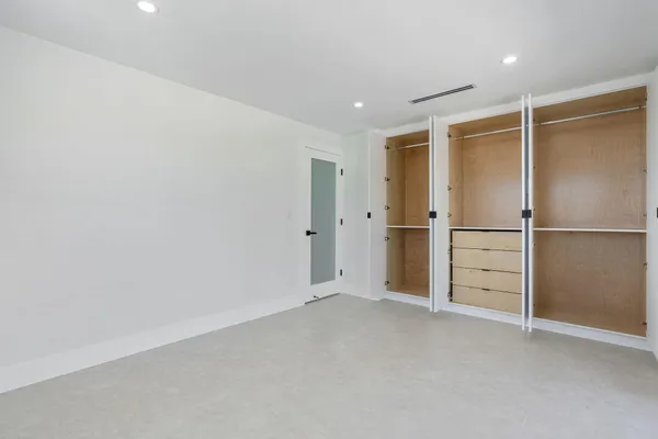 a front view of house with yard and swimming pool