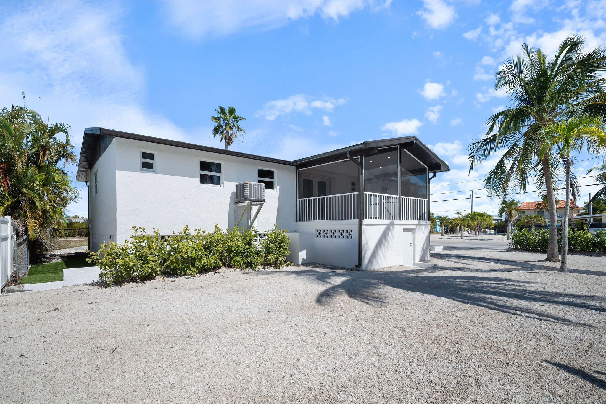 30368 Killdeer Lane Big Pine Key, FL 33043 - Photo 50 of 59 a front view of a house with a yard and garage