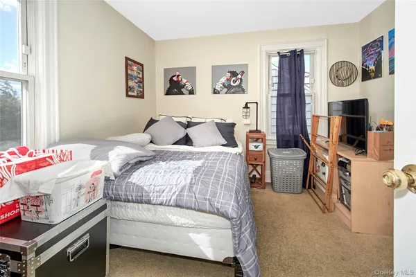 a bedroom with a bed and cabinets