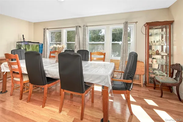 a dining room with furniture a livingroom and wooden floor