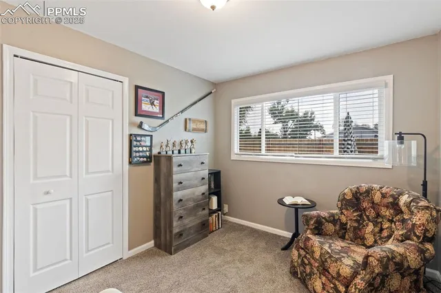 a bedroom with furniture and a window