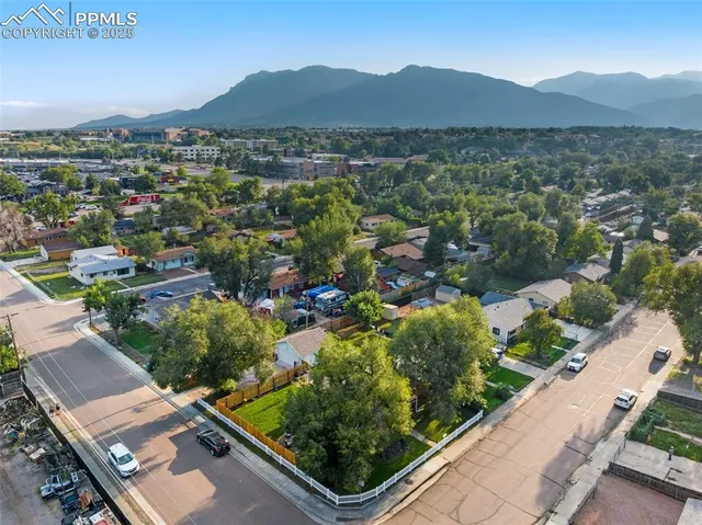 an aerial view of a house with a garden