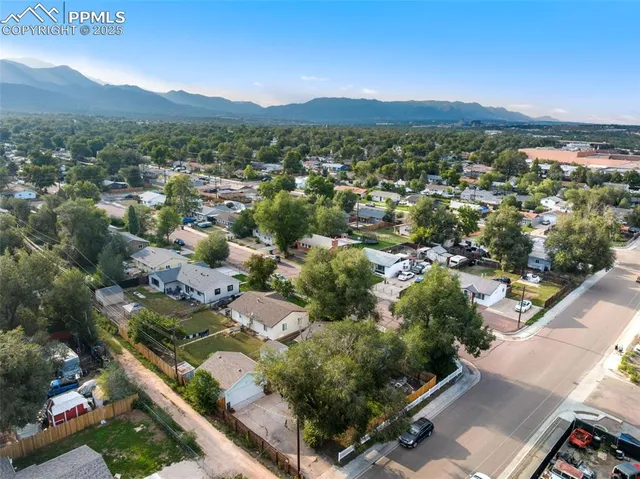 an aerial view of residential houses with outdoor space