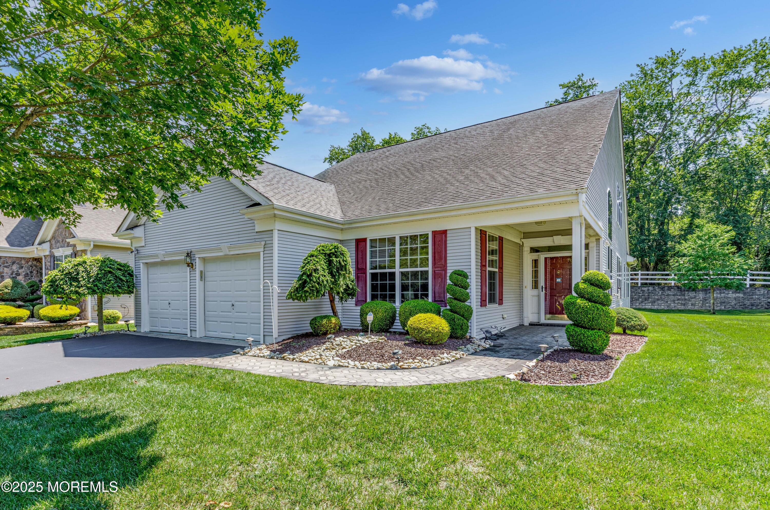 a view of a house with a yard porch and sitting area