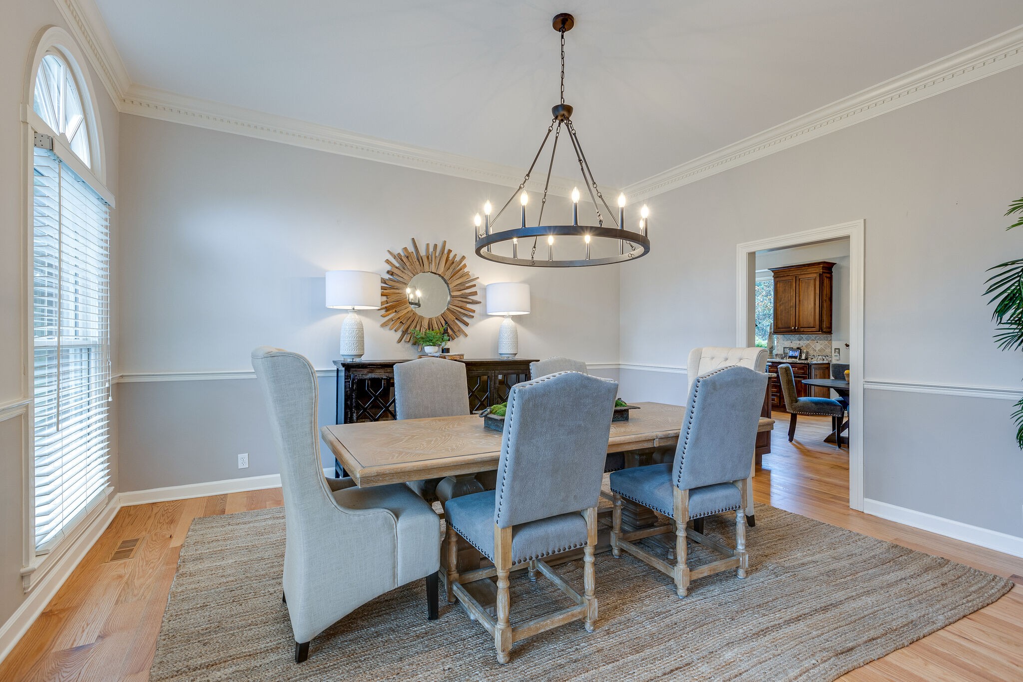 9501 Clovercroft Road Franklin, TN 37067 - Photo 12 of 70 a view of a dining room with furniture a chandelier and wooden floor