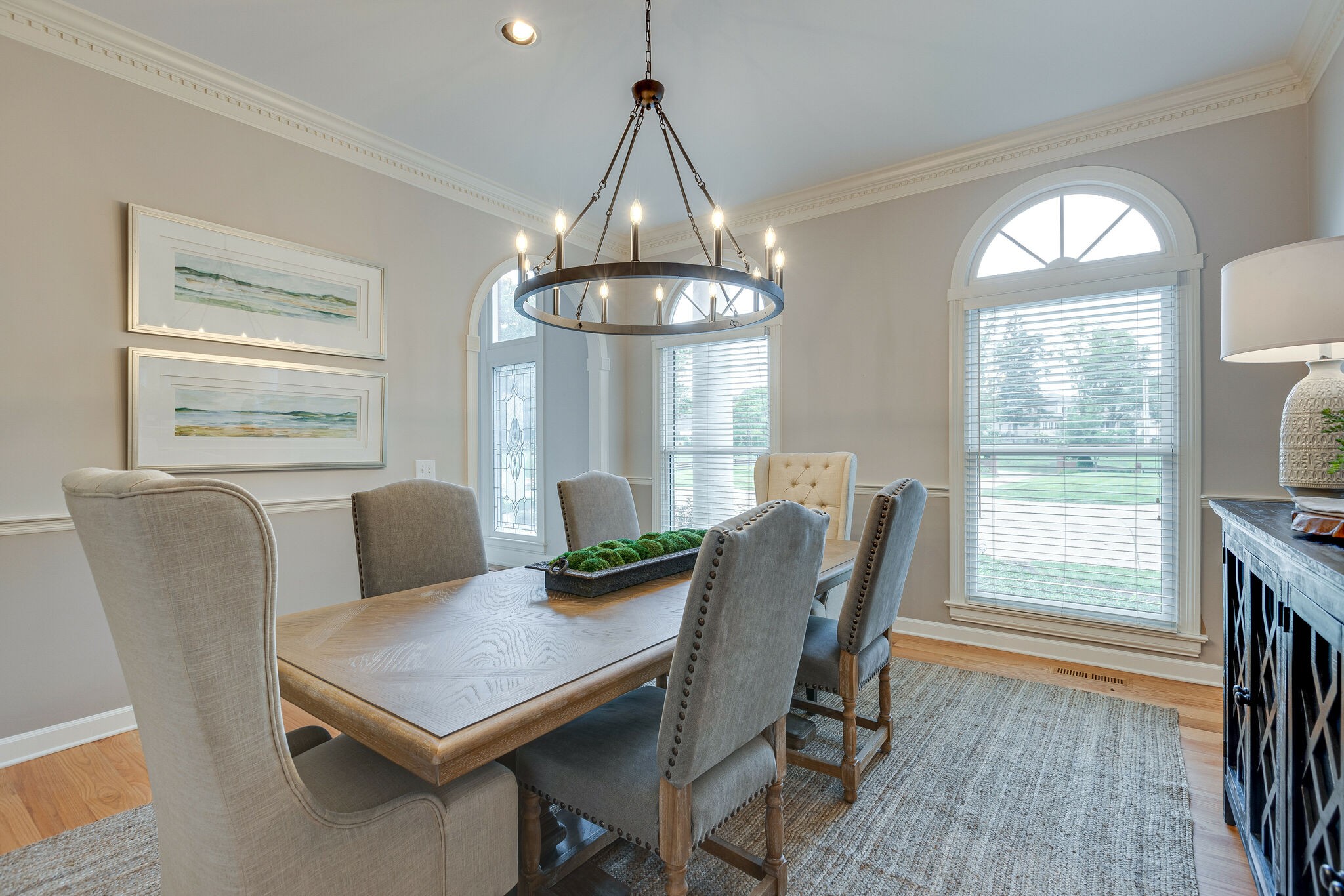 9501 Clovercroft Road Franklin, TN 37067 - Photo 13 of 70 a dining room with furniture a chandelier and wooden floor