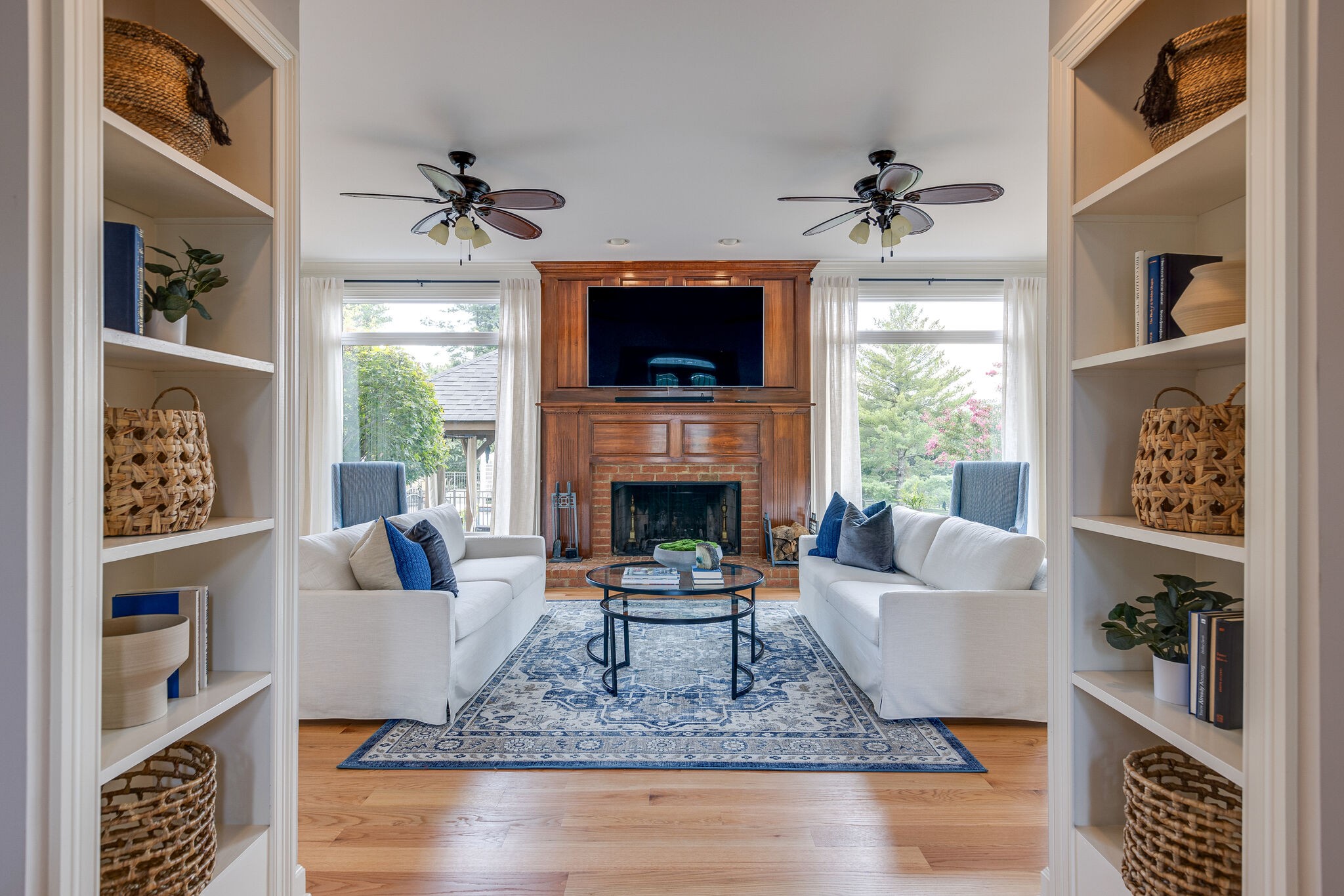 9501 Clovercroft Road Franklin, TN 37067 - Photo 15 of 70 a living room with furniture a flat screen tv and a fireplace