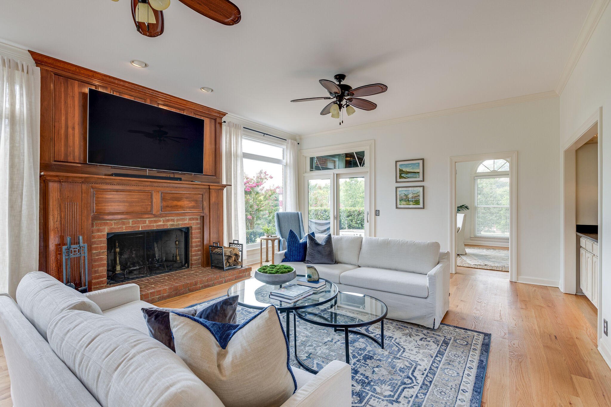 9501 Clovercroft Road Franklin, TN 37067 - Photo 19 of 70 a living room with furniture a flat screen tv and a fireplace