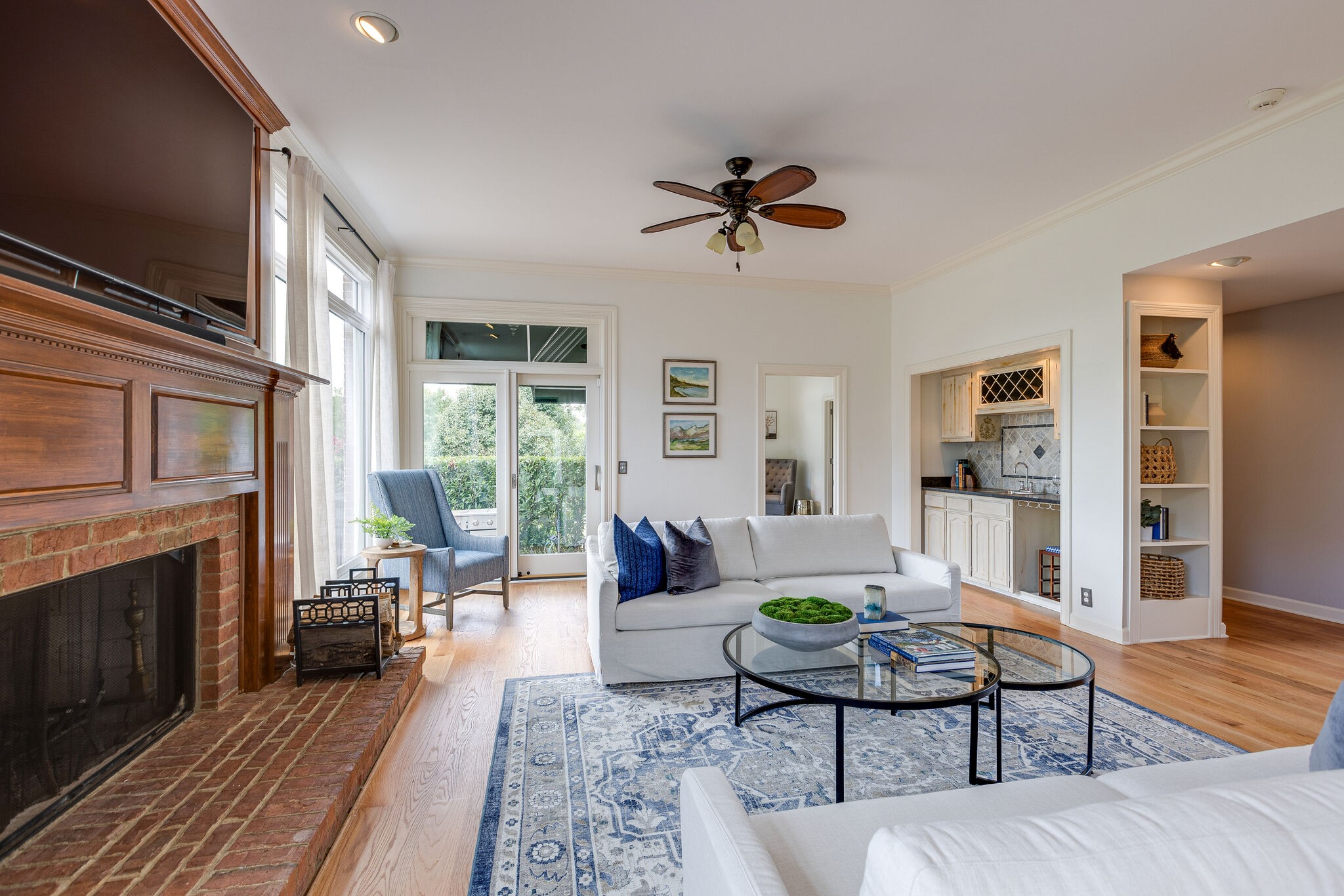 9501 Clovercroft Road Franklin, TN 37067 - Photo 20 of 70 a living room with furniture a fireplace and a wooden floor