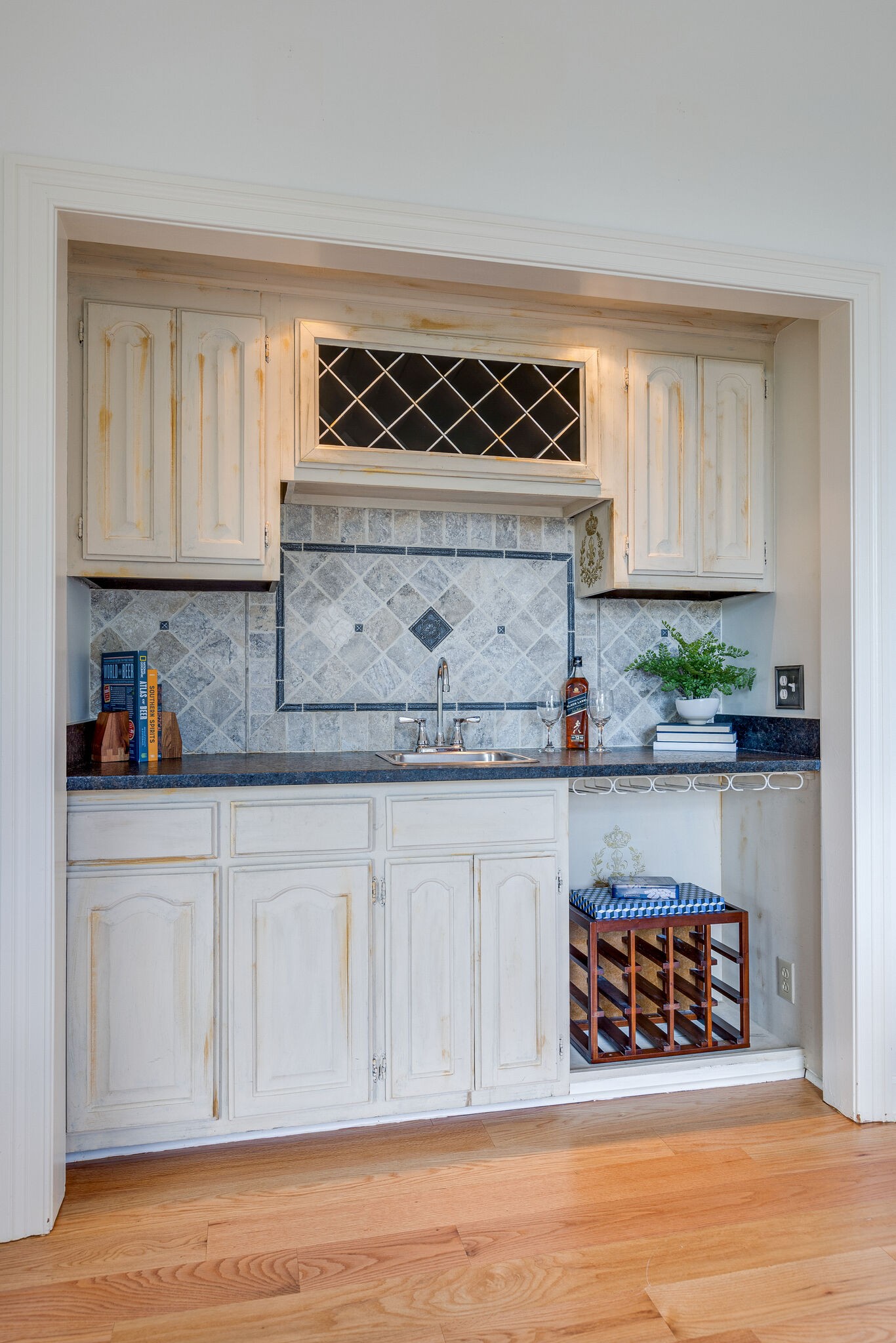 9501 Clovercroft Road Franklin, TN 37067 - Photo 21 of 70 a kitchen with white cabinets and a stove