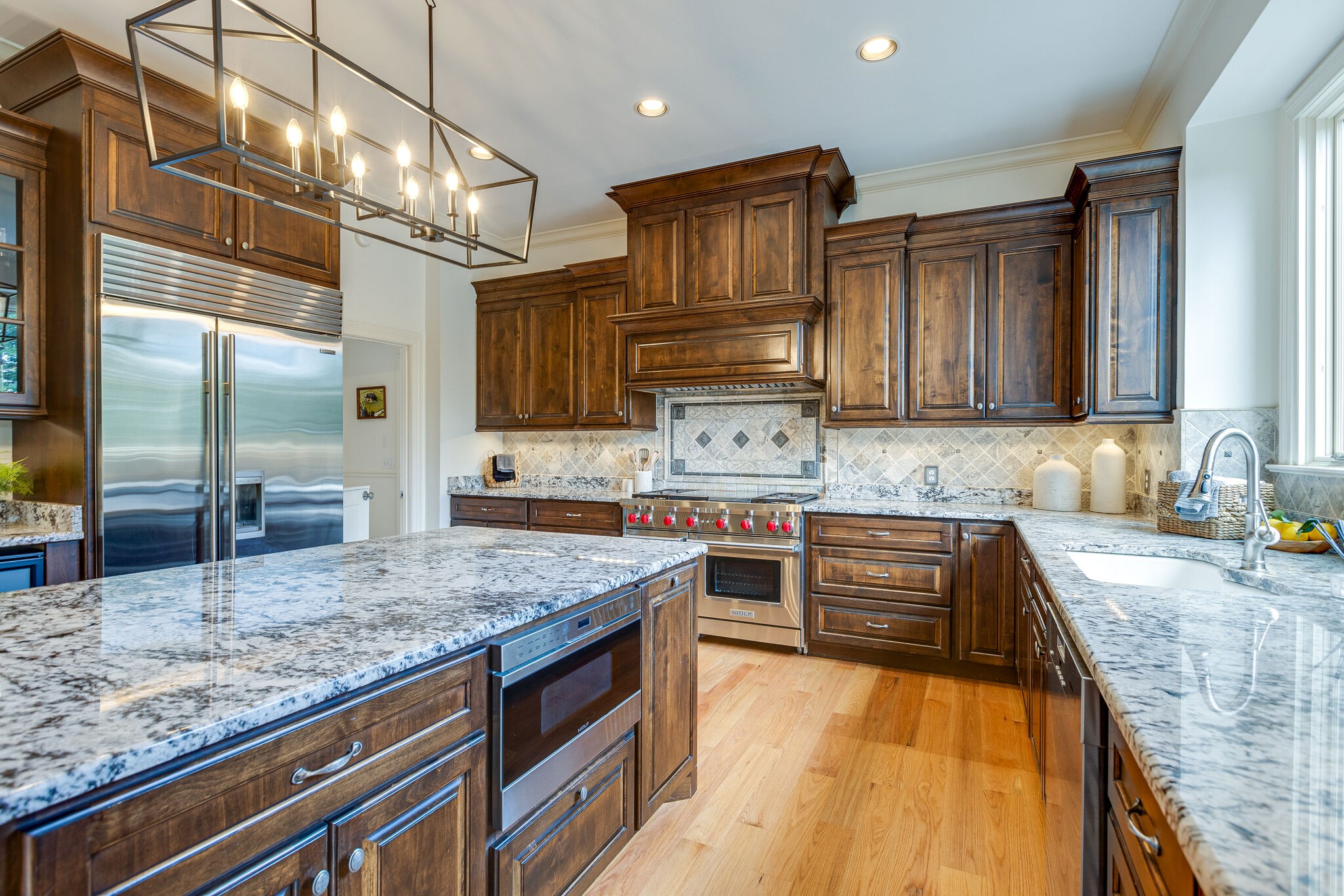 9501 Clovercroft Road Franklin, TN 37067 - Photo 26 of 70 a kitchen with stainless steel appliances granite countertop a sink stove and refrigerator