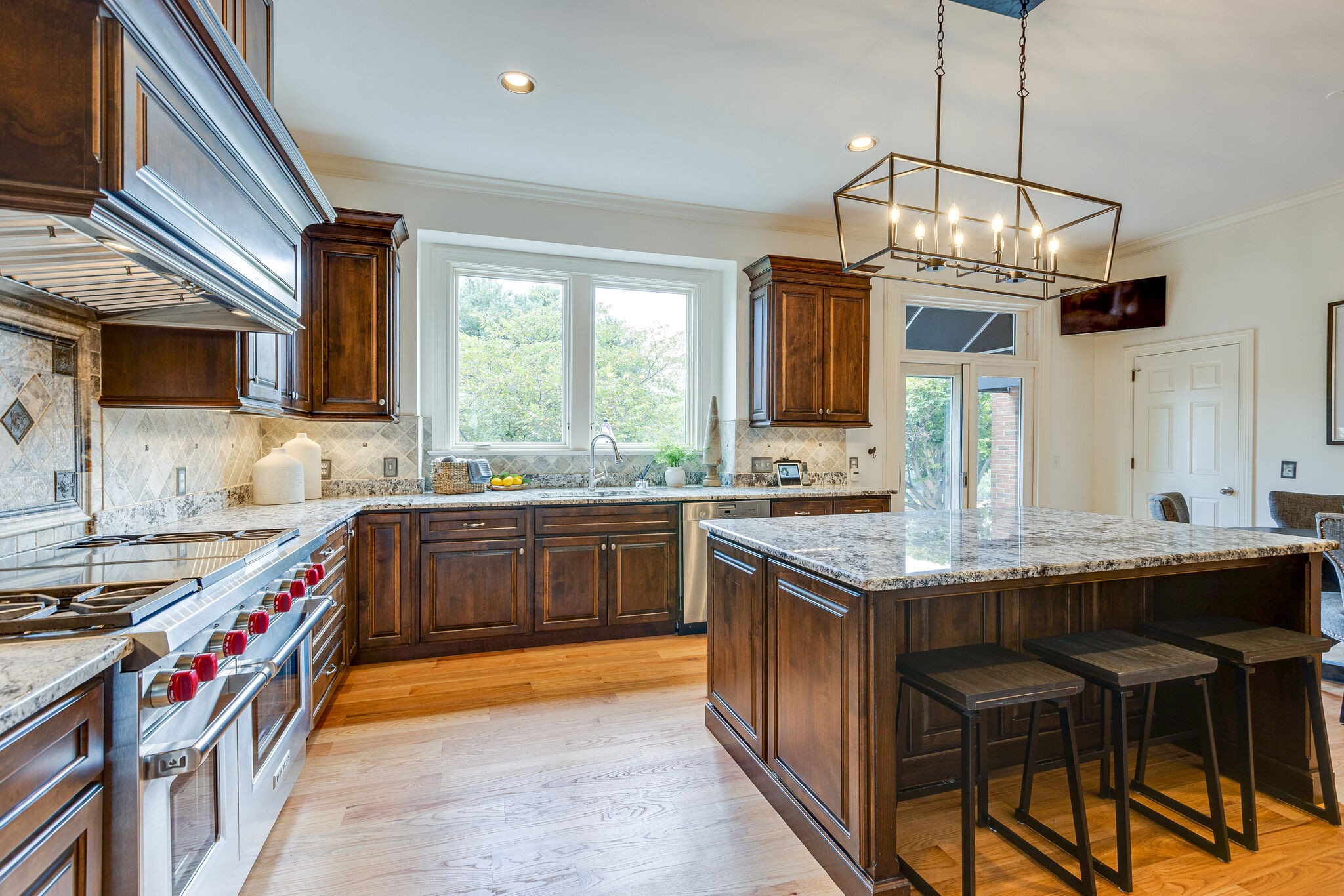 9501 Clovercroft Road Franklin, TN 37067 - Photo 28 of 70 a kitchen with stainless steel appliances granite countertop a sink and a stove