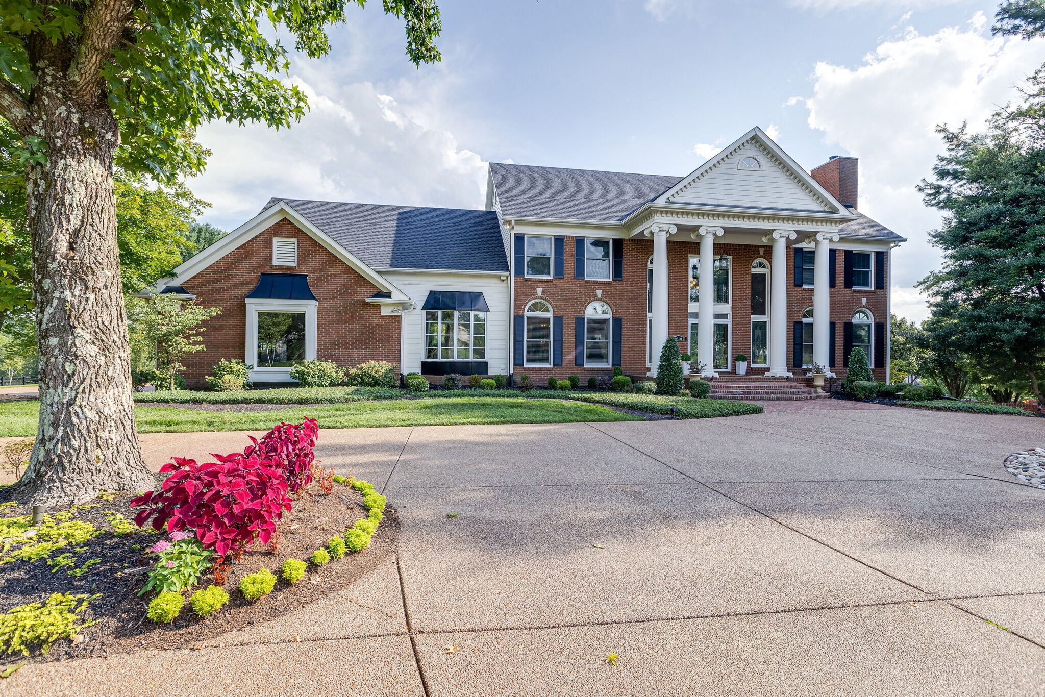 9501 Clovercroft Road Franklin, TN 37067 - Photo 3 of 70 a front view of a house with a yard