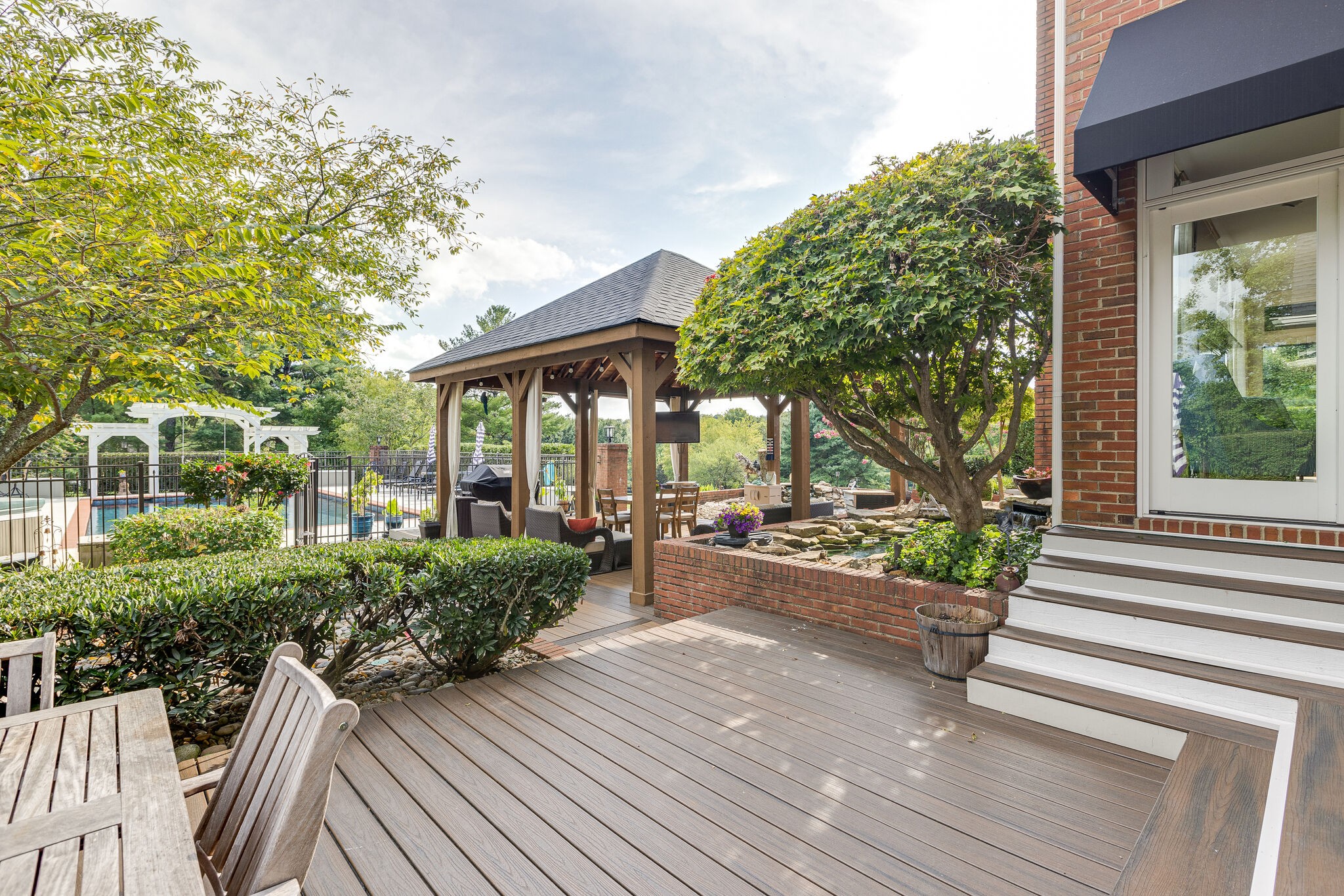 9501 Clovercroft Road Franklin, TN 37067 - Photo 55 of 70 a view of a house with backyard and garden