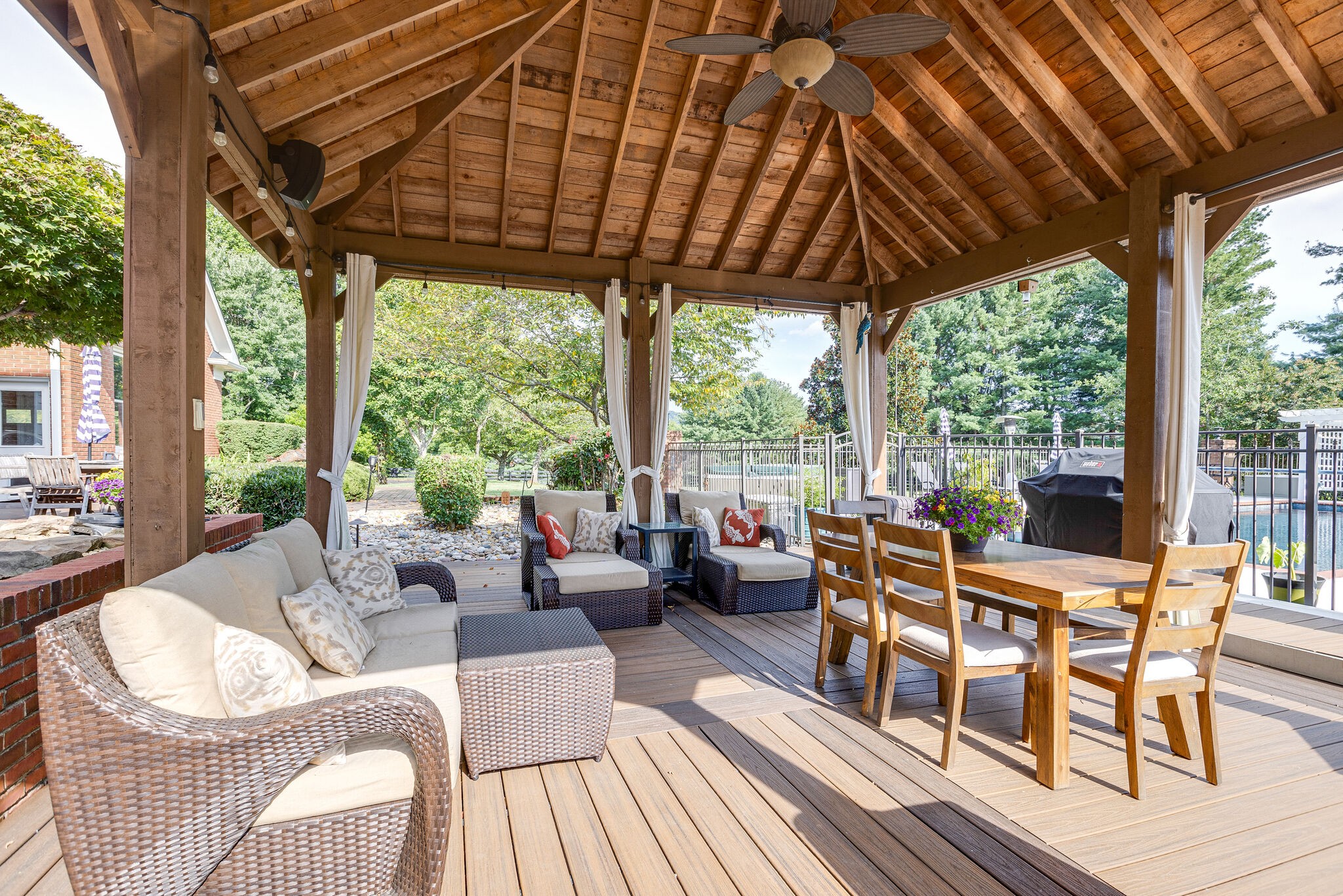 9501 Clovercroft Road Franklin, TN 37067 - Photo 59 of 70 a view of a patio with couches and chairs under an umbrella with a patio