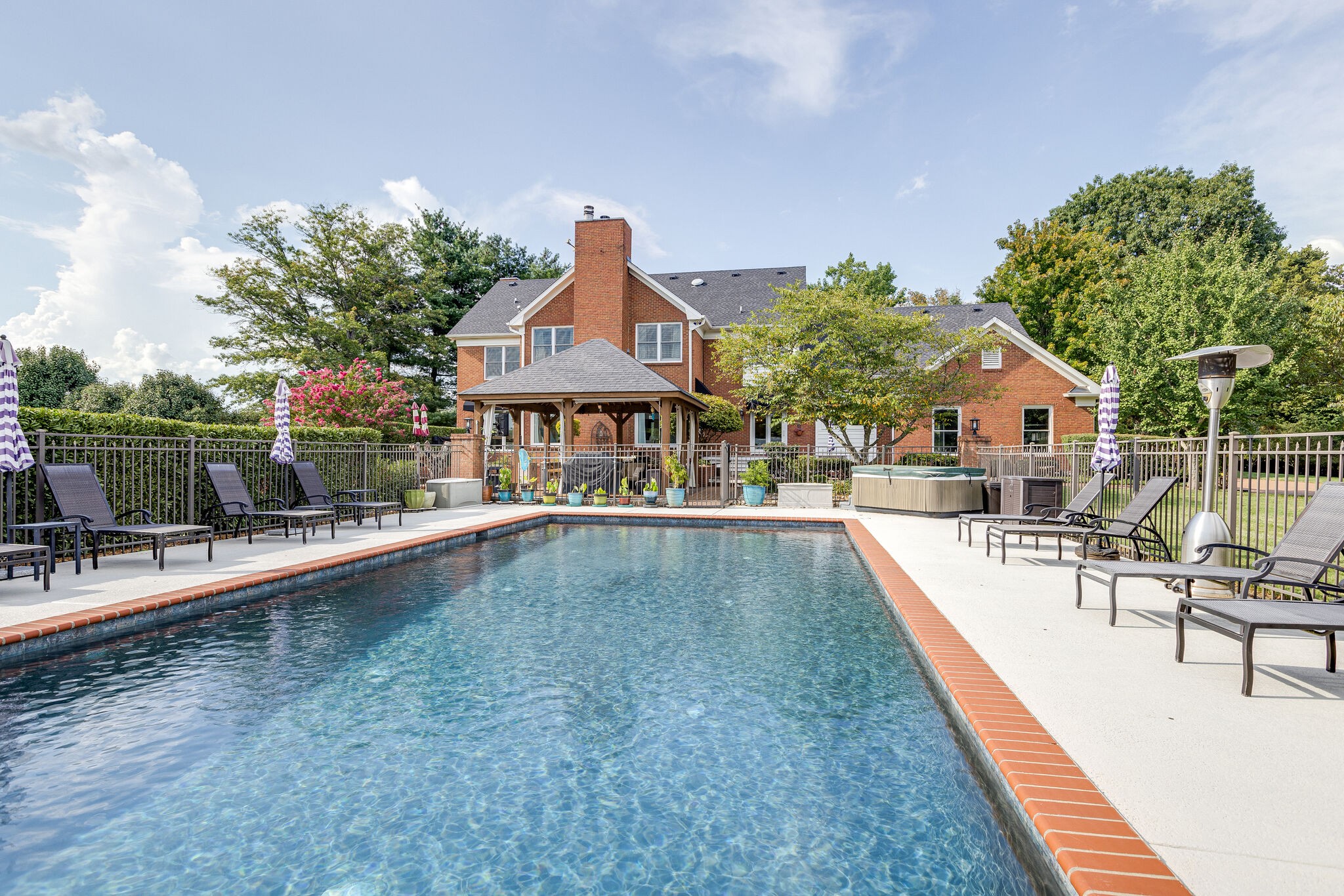 9501 Clovercroft Road Franklin, TN 37067 - Photo 62 of 70 swimming pool view with a seating space and a garden view