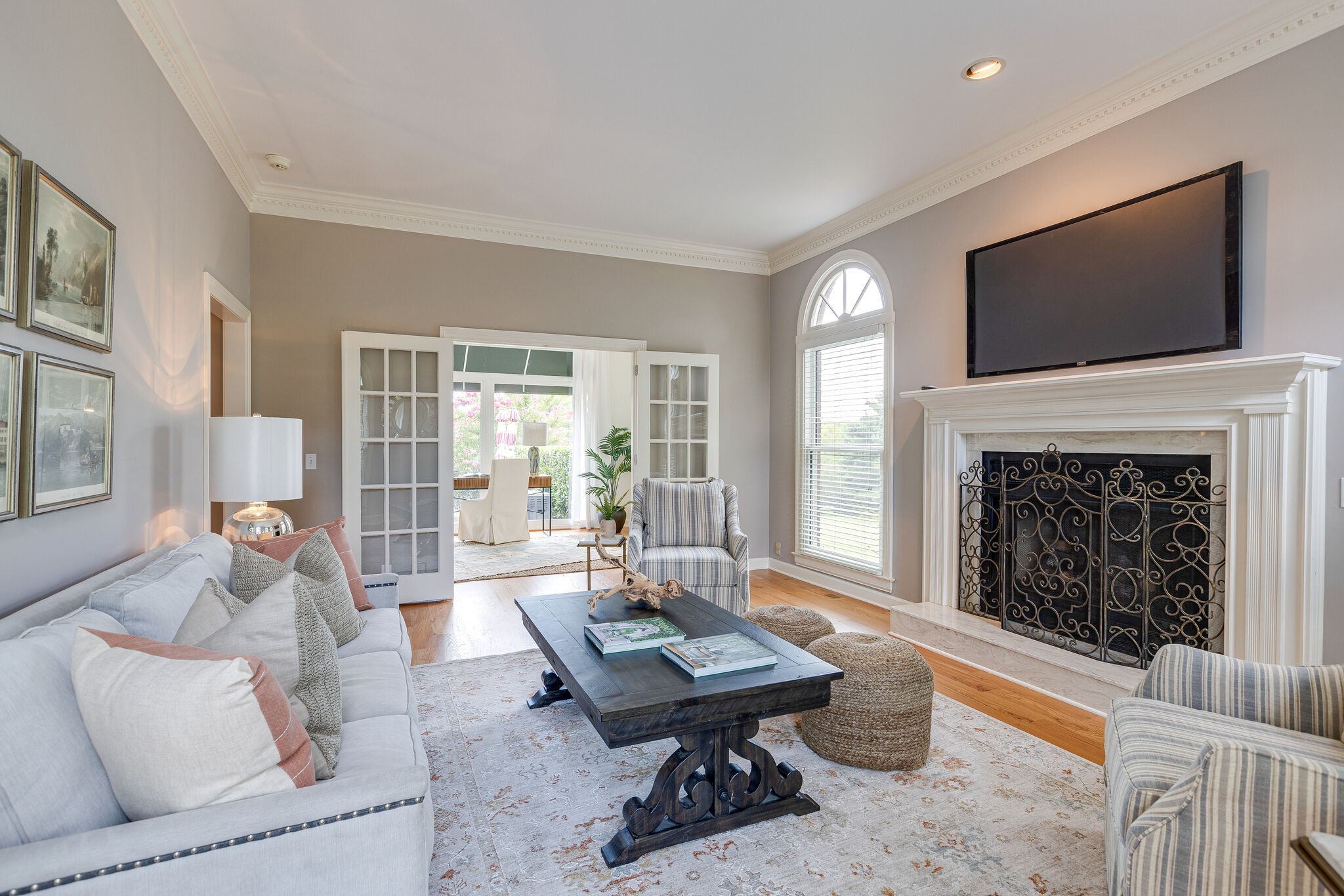 9501 Clovercroft Road Franklin, TN 37067 - Photo 9 of 70 a living room with furniture a flat screen tv and a fireplace