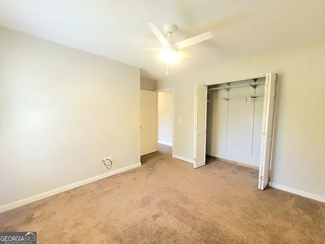 an empty room with a bathroom