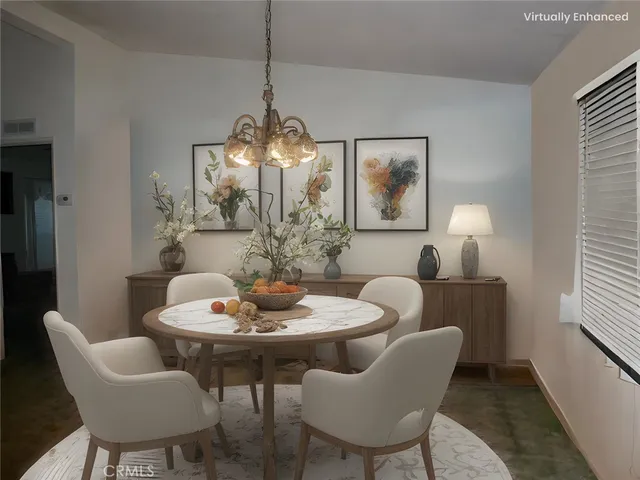 a dining room with furniture and window