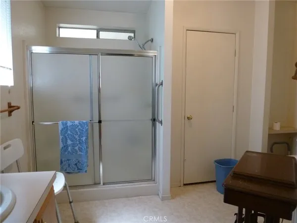 a bathroom with a shower and a mirror