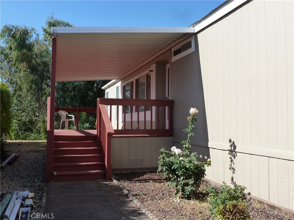 5813 Pacific Heights Road, Unit 103 Oroville, CA 95965 - Photo 20 of 21 a front view of a house with a garden