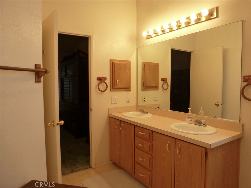 5813 Pacific Heights Road, Unit 103 Oroville, CA 95965 - Photo 3 of 20 a bathroom with a sink and a mirror