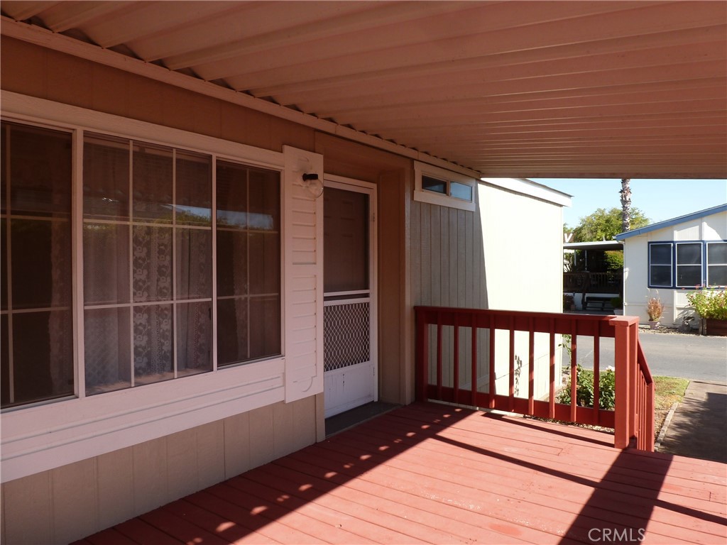 5813 Pacific Heights Road, Unit 103 Oroville, CA 95965 - Photo 6 of 21 a view of balcony with wooden floor and floor to ceiling window
