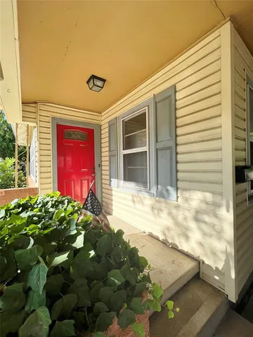 a view of a house with a small yard