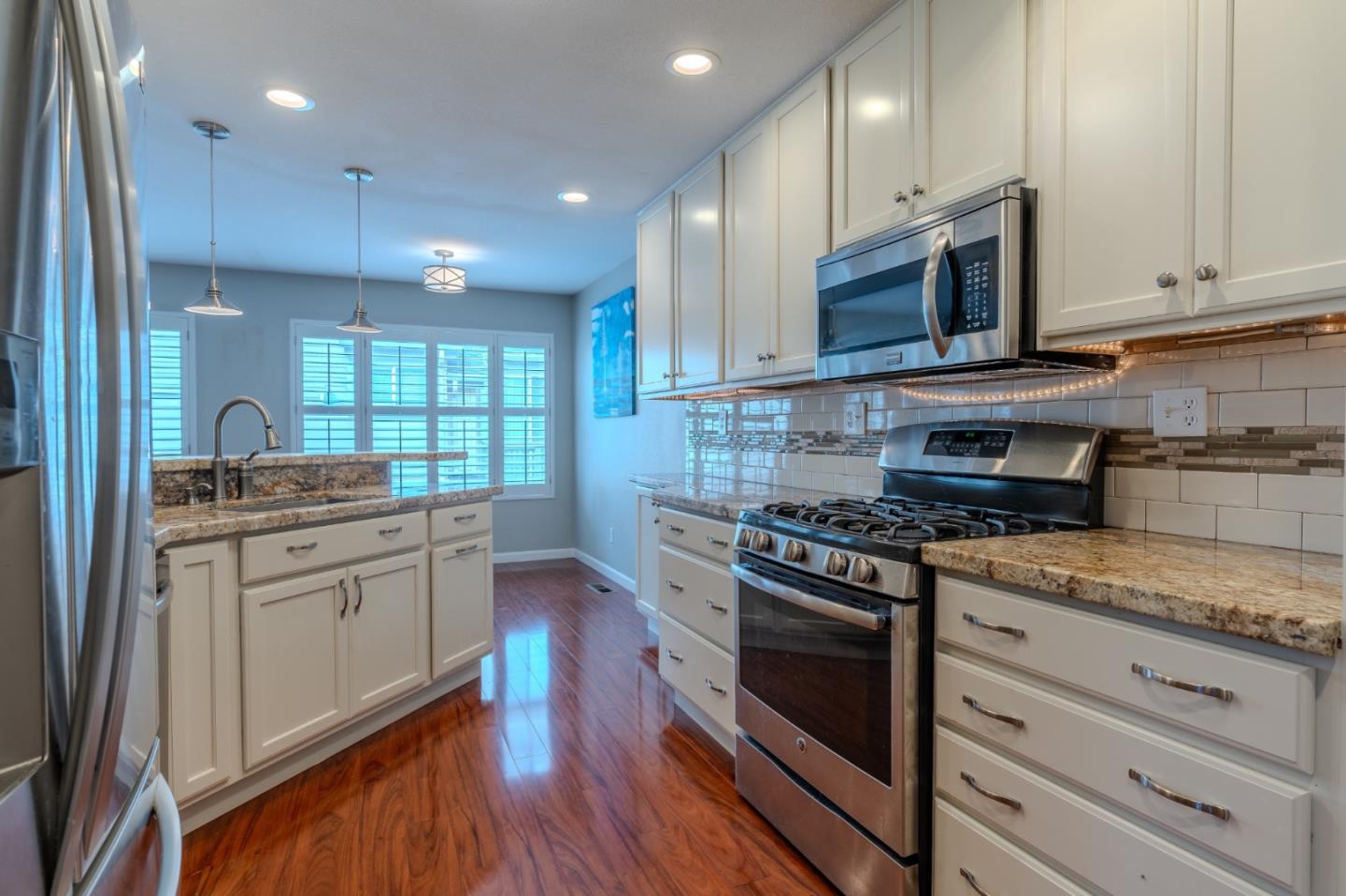 132 Patrick Way Half Moon Bay, CA 94019 - Photo 12 of 29 a kitchen with granite countertop cabinets stainless steel appliances and wooden floor