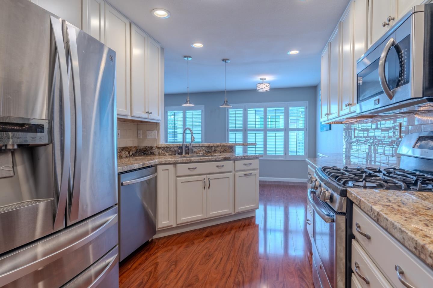 132 Patrick Way Half Moon Bay, CA 94019 - Photo 13 of 29 a kitchen with a stove a sink and a refrigerator