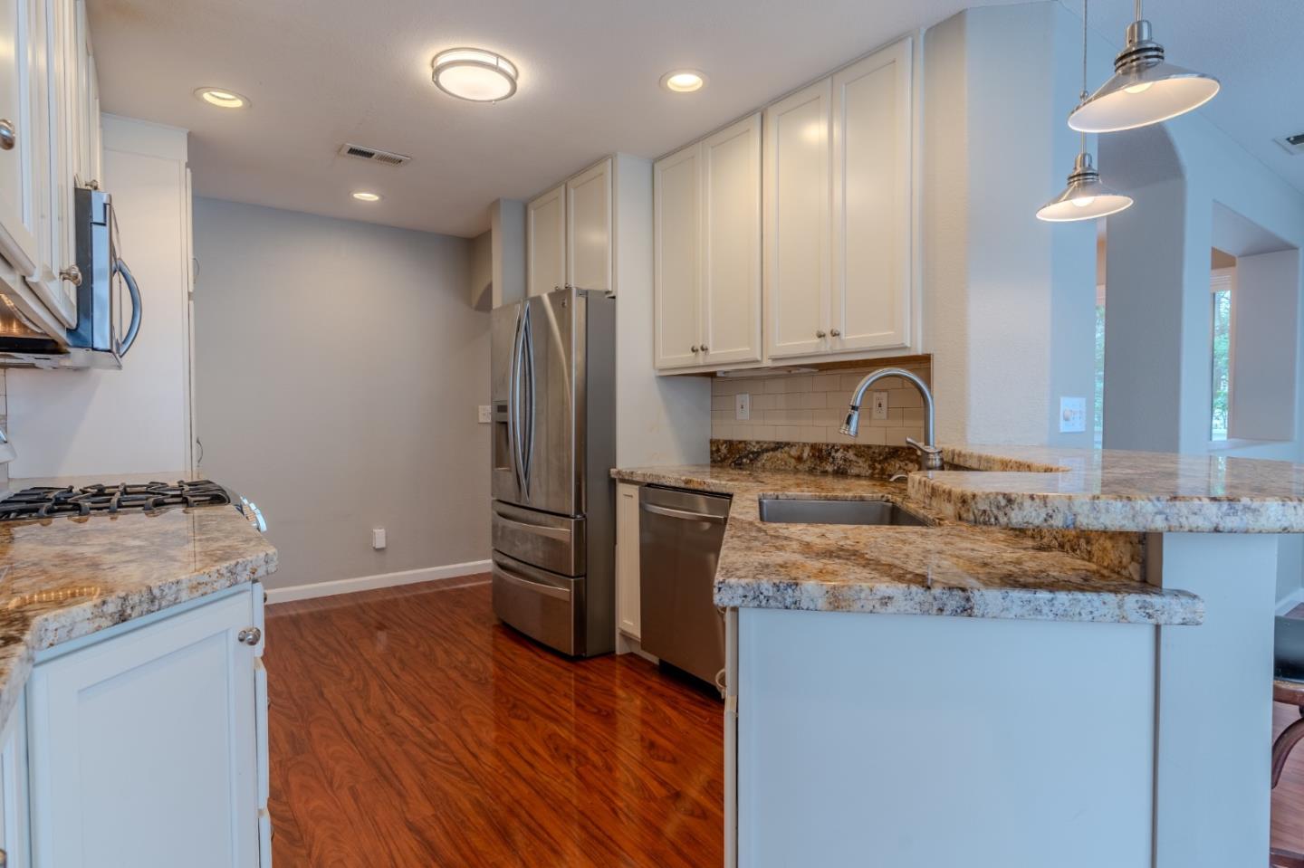 132 Patrick Way Half Moon Bay, CA 94019 - Photo 14 of 29 a kitchen with a refrigerator and a sink