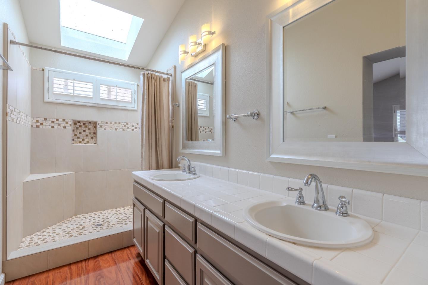 132 Patrick Way Half Moon Bay, CA 94019 - Photo 24 of 29 a bathroom with a sink and a mirror