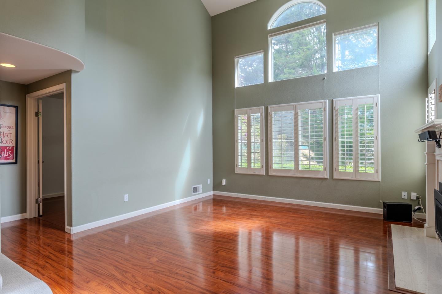 132 Patrick Way Half Moon Bay, CA 94019 - Photo 3 of 29 a view of an empty room with wooden floor and a window